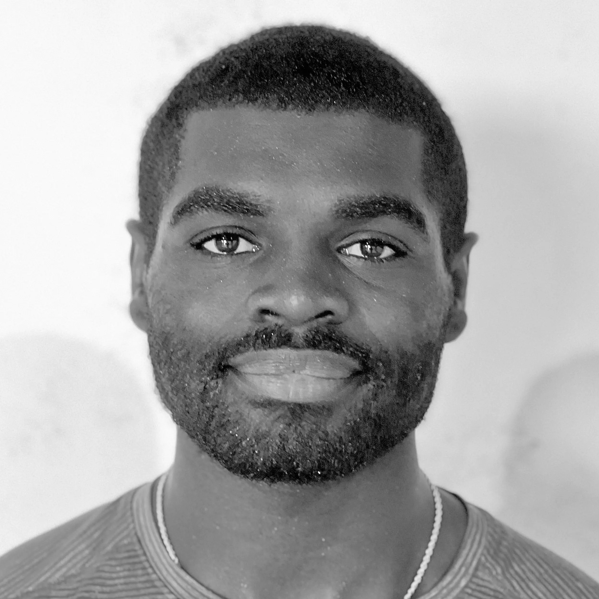 A black and white head shot image of Lee Evan Fish.